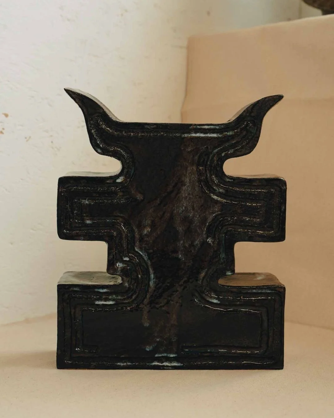 Horn Vase

Hand built in stoneware the Horn Vase is made by Jessica Tremaine in Penzance in the UK. Its strong symmetrical form and dark layered glaze draw on references to ritual objects and industrial shapes. It can be displayed as a sculptural pie