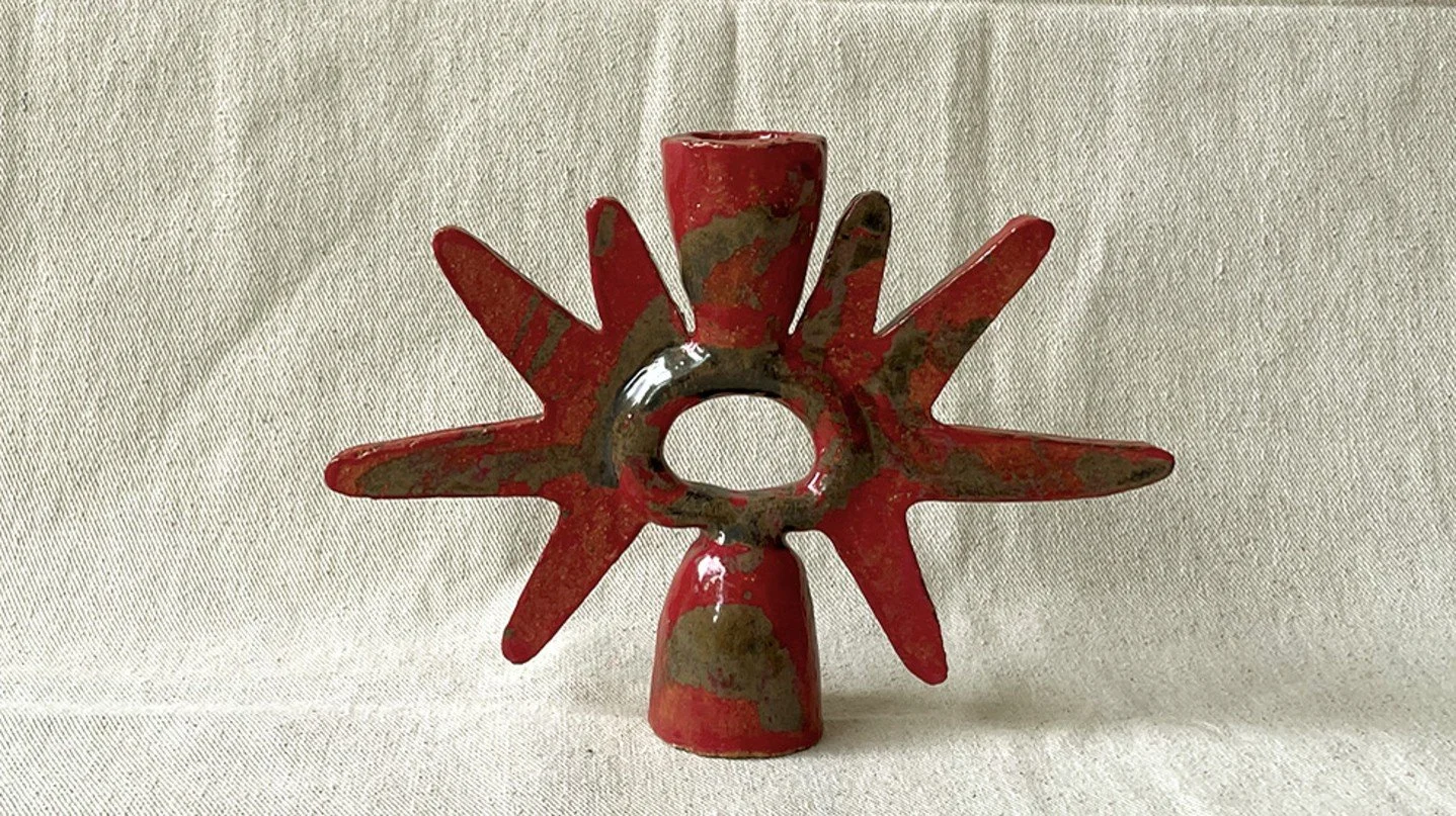 Rays Candlestick

Hand built in stoneware the Rays Blood Brush Candlestick is made by Jessica Tremaine in Penzance in the UK. Its radiating symmetrical form and bloodbrush glaze reference ritual objects. It can be displayed as a sculptural piece or u