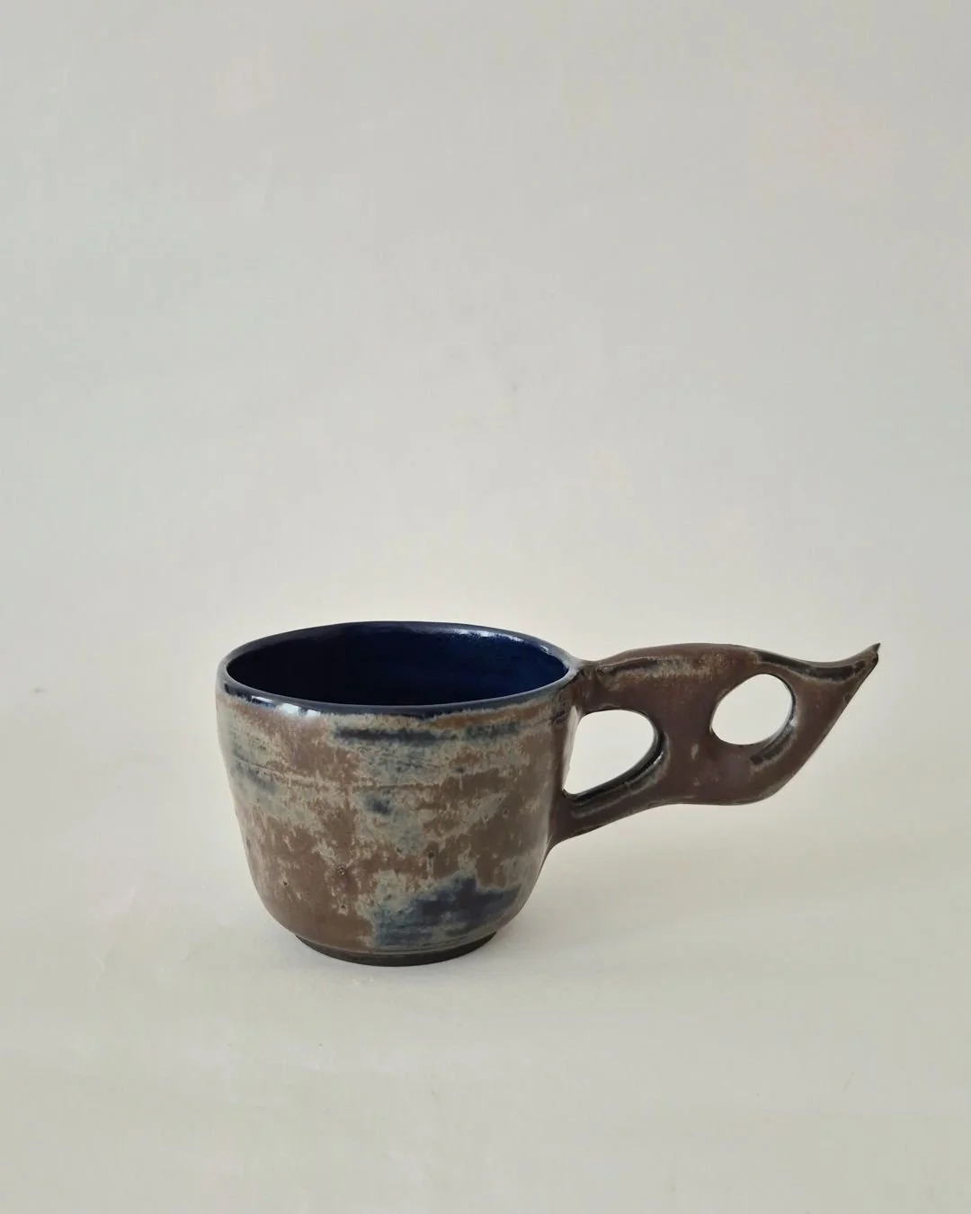 "I often combine wheel work with hand built elements. In the beginning I experimented constantly, but repetition now plays an important role. Making similar pieces again and again refines not only the form but also my ability to stay grounded. S