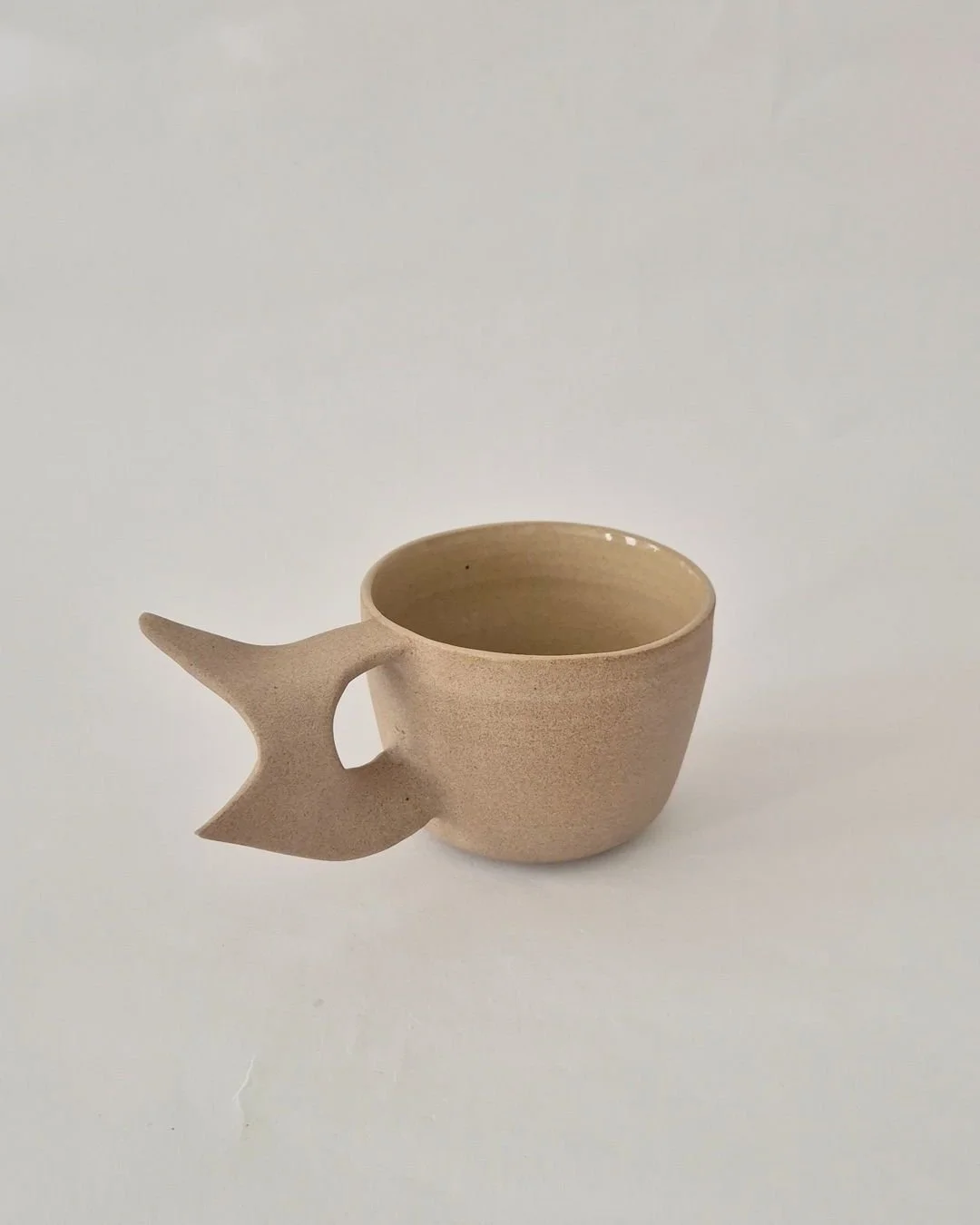Flame Mug

Wheel-thrown in stoneware with a hand-built handle, the Flame Mug is made by Marjorie Broudieu in Amsterdam.The form is deliberate and grounded, balancing function with an aesthetic inspired by Broudieu&rsquo;s interest in Surrealist thoug