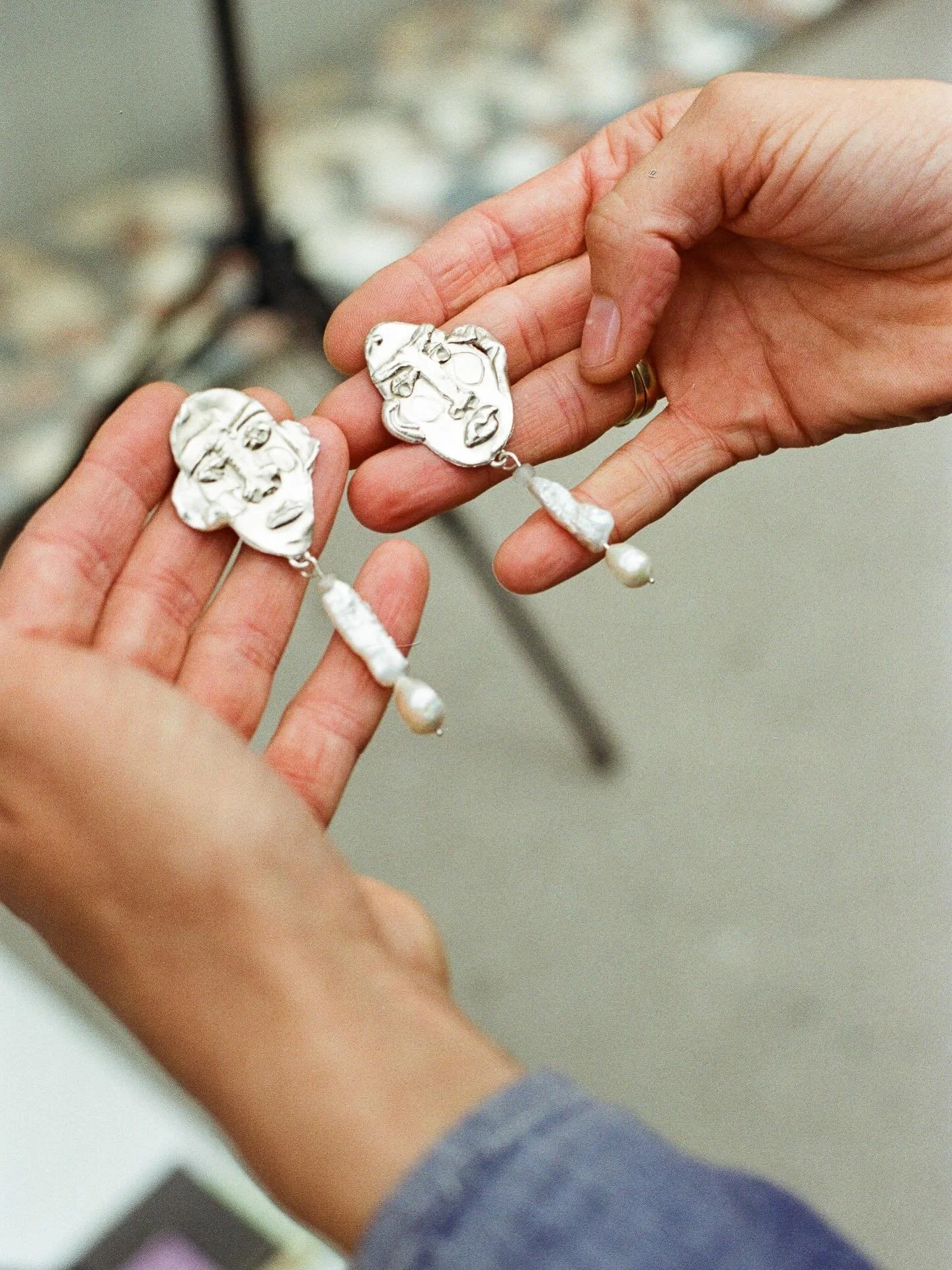 Handcrafted in recycled sterling silver, the Silver Character Over the Moon with Tiny Pearl earrings are expressive and finely detailed, carrying the artist&rsquo;s signature motifs. Part of our current selection of earrings by Anna Riess.

Now avail