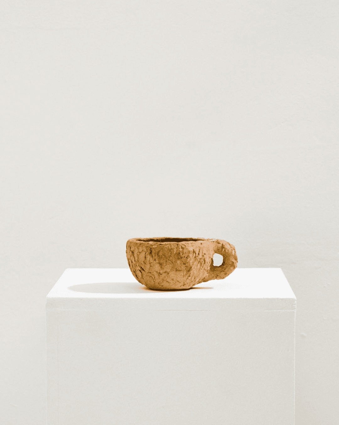 Textured Cup
Handbuilt using the pinching technique, the Textured cup is made by Lou Thomas in her Marseille studio. Crafted in light red stoneware, the exterior is left to showcase the raw grain and surface variations of the material. Its functional