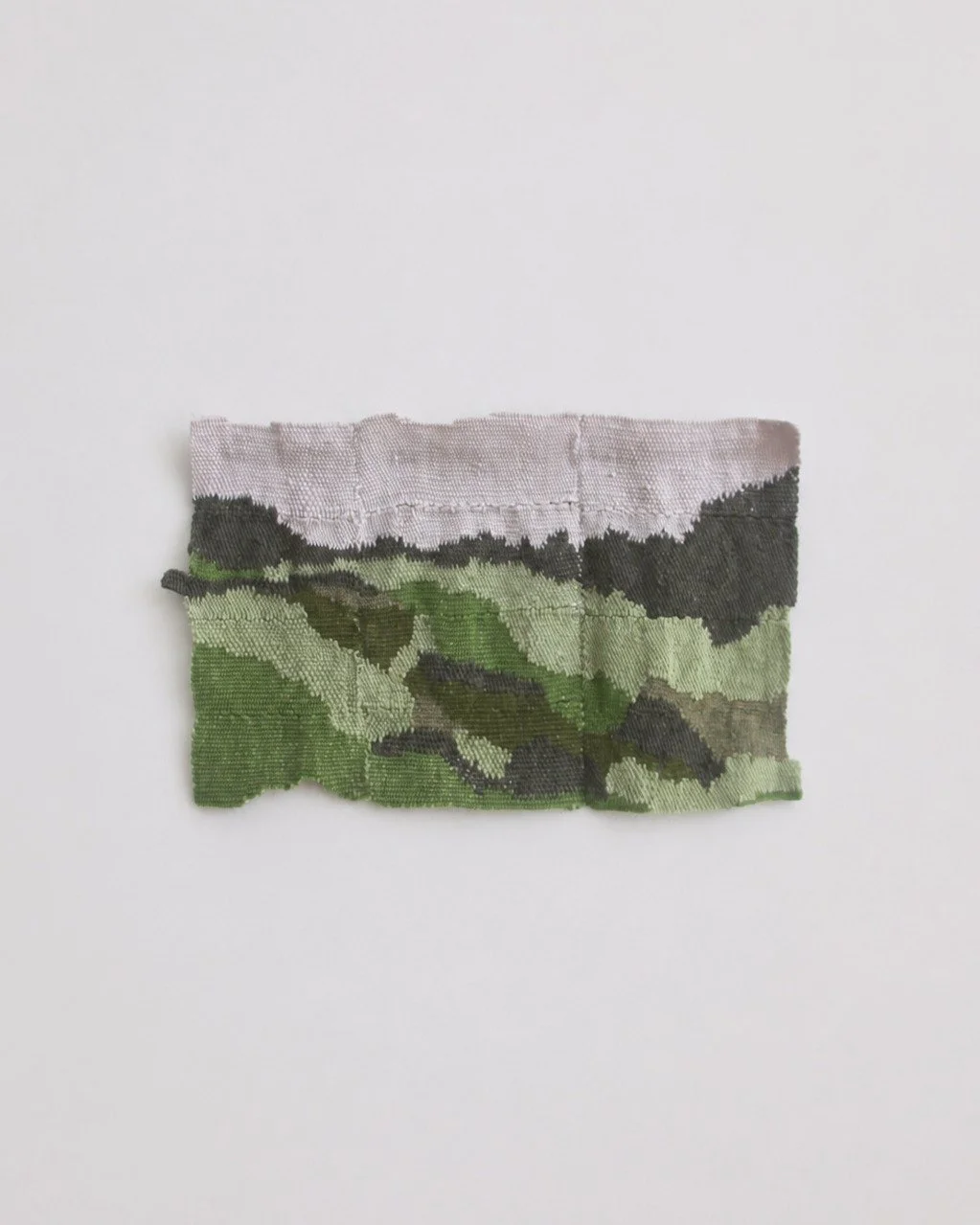 S&atilde;o Miguel Wall Piece 
Handwoven in wool and alpaca by Maria Elisa Vale in Portugal, S&atilde;o Miguel was developed after a journey to S&atilde;o Miguel, the main island of the Azores. Influenced by volcanic textures, humid greens, and earthy