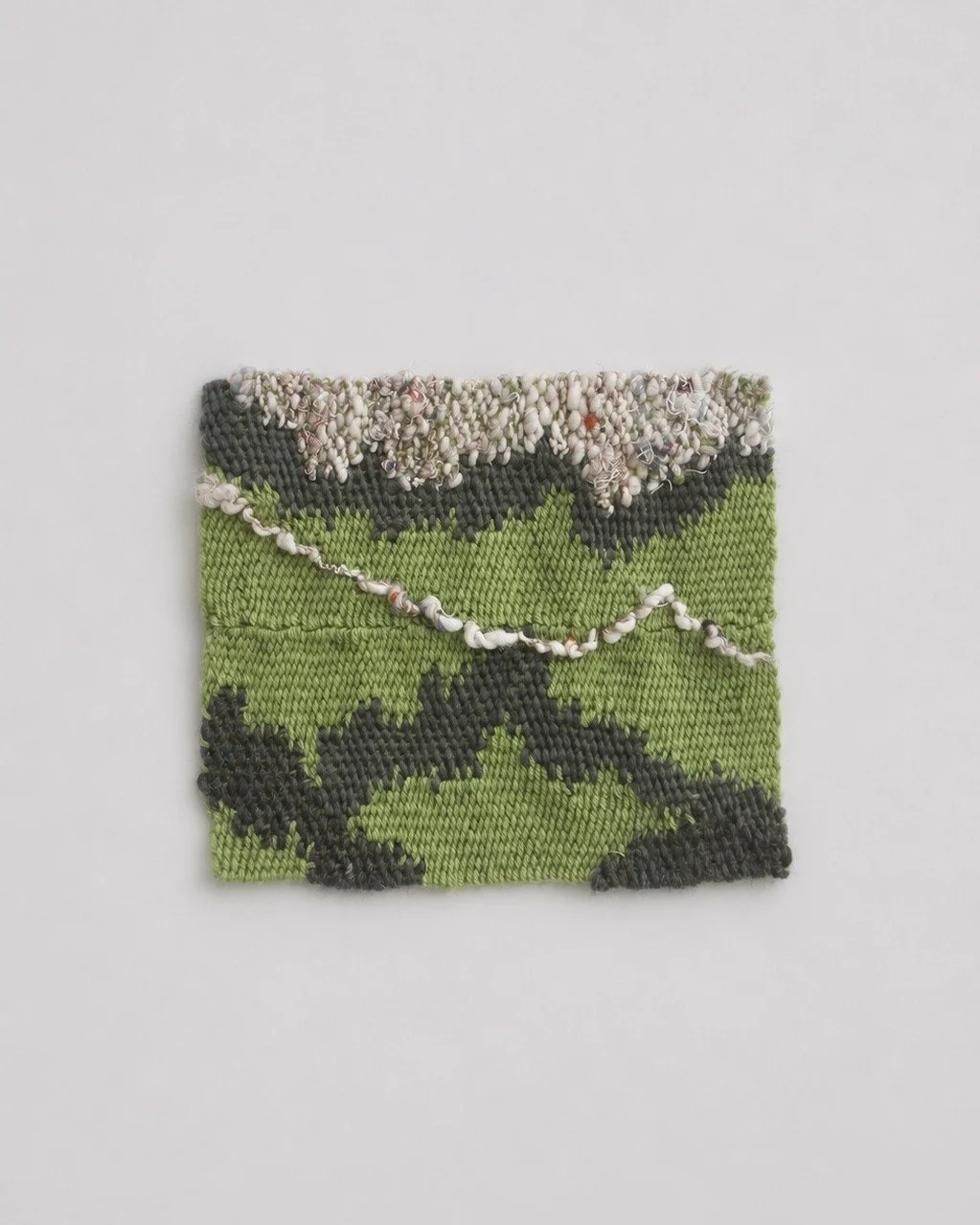 Nordeste Wall Piece 

Handwoven in wool and handspun reclaimed textile fibers by Maria Elisa Vale in Portugal, Nordeste explores landscape and material through tapestry weaving and assembled textile fragments. Inspired by the S&atilde;o Miguel region