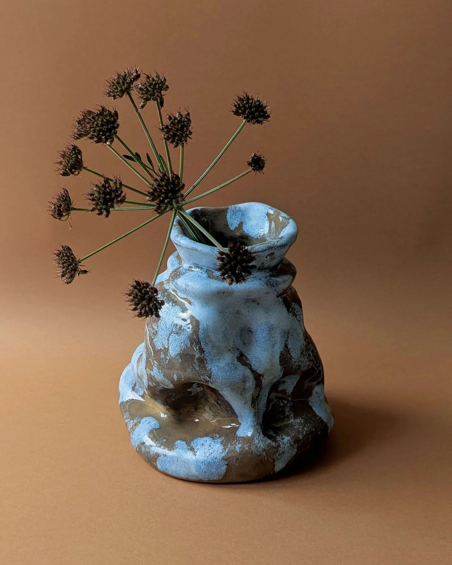 Vase No. 4 Glacier

Hand built in dark brown stoneware using the coil technique by Elsa Claesen in Santa Catarina, Portugal, Vase No. 4 Glacier explores sculptural form through its glacier inspired silhouette and organic movement. Finished with trans