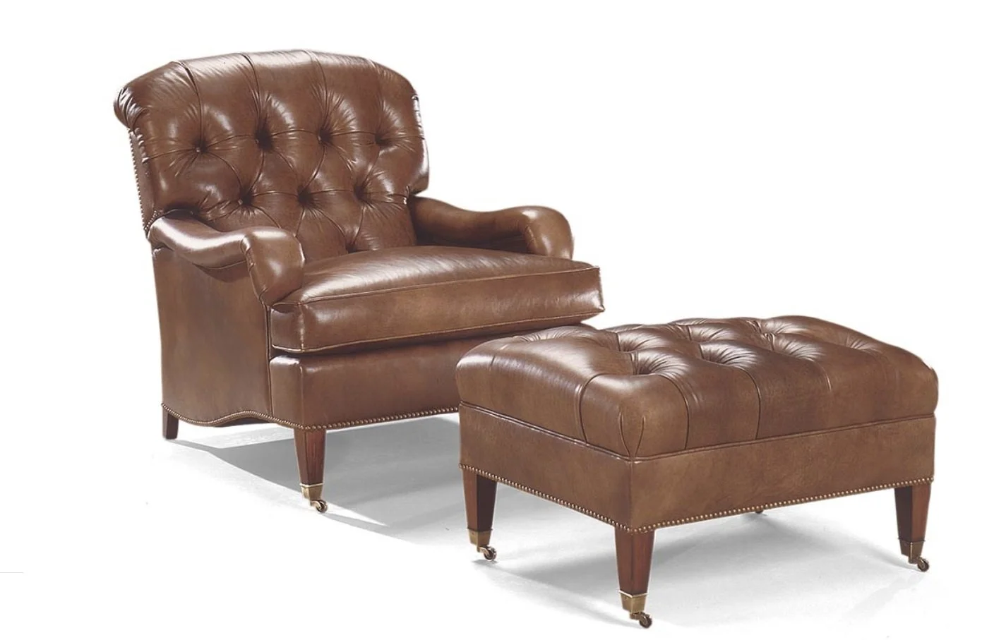 Tufted saddle color leather recliner in leather with ottoman from Ferrell Mittman