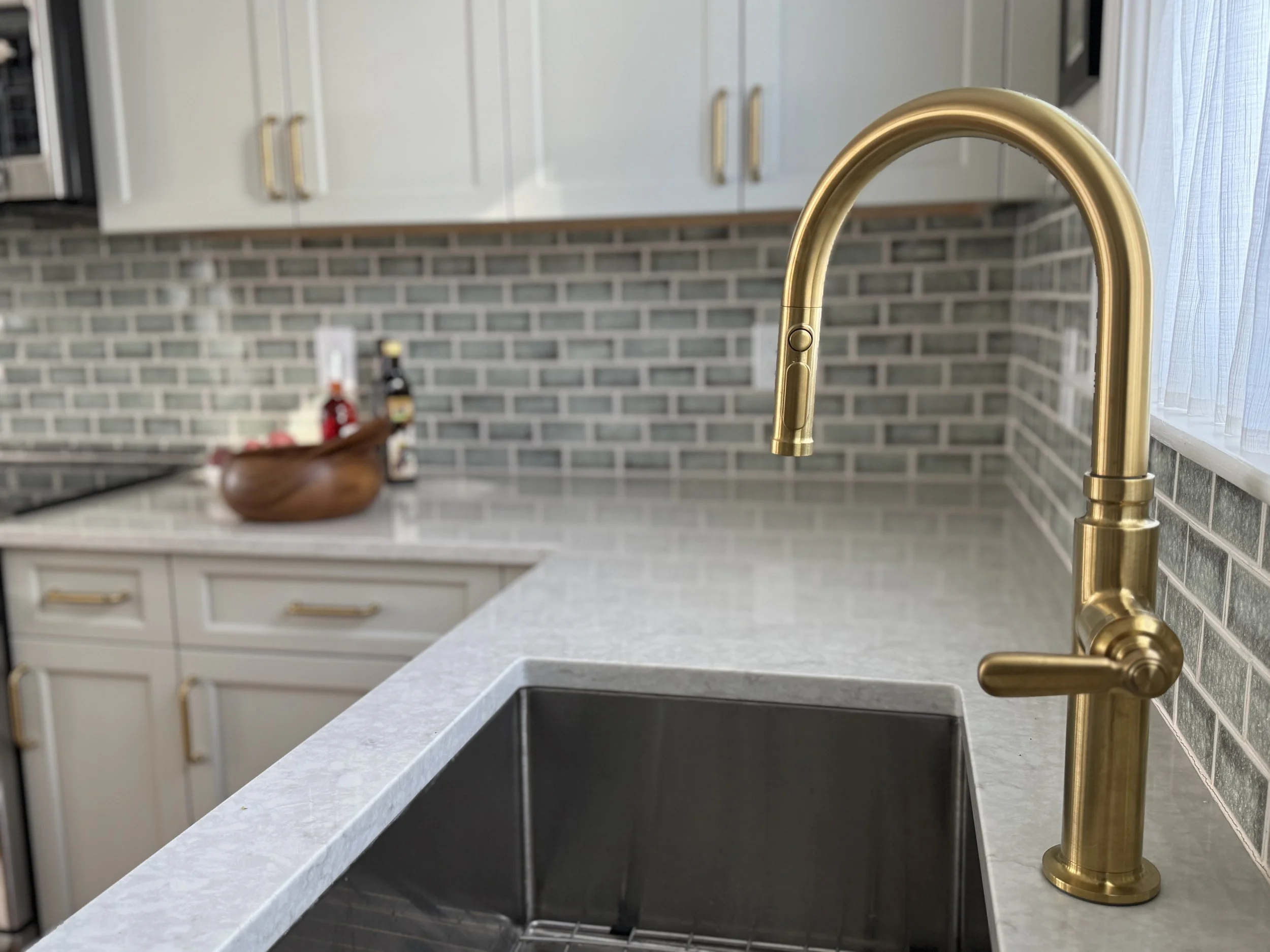 arlington-kitchen-brass-faucet-green-tile-backsplash-countertop-detail-sink-abbeyk.jpg.JPG