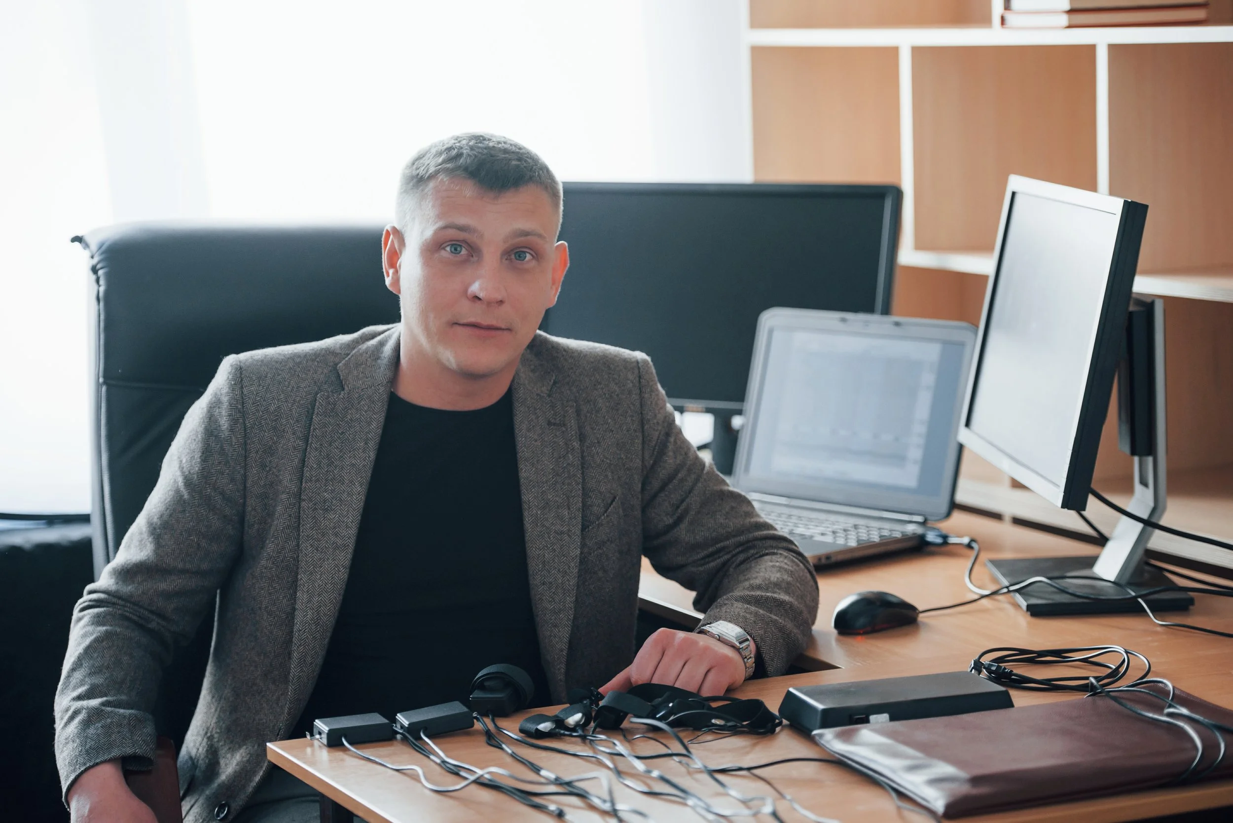 professional-services-polygraph-examiner-works-office-with-his-lie-detector-s-equipment.jpg