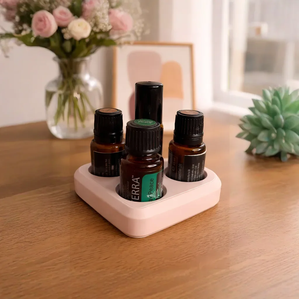 PetalCradle rosa doTERRA Ölhalter Herzform mit 3 ätherischen Ölen und Sukkulente auf Holztisch