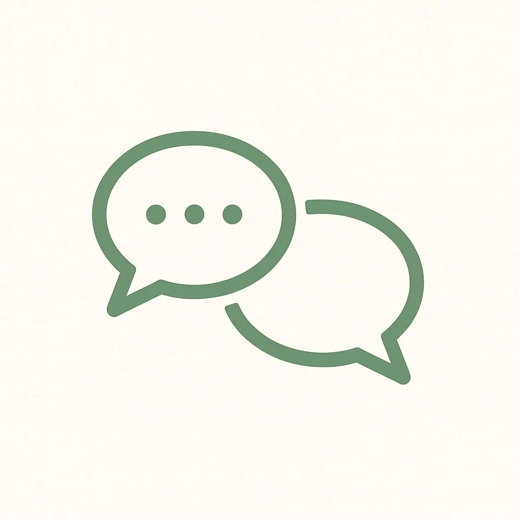 Two overlapping chat bubbles, one with three dots inside, on a light background.