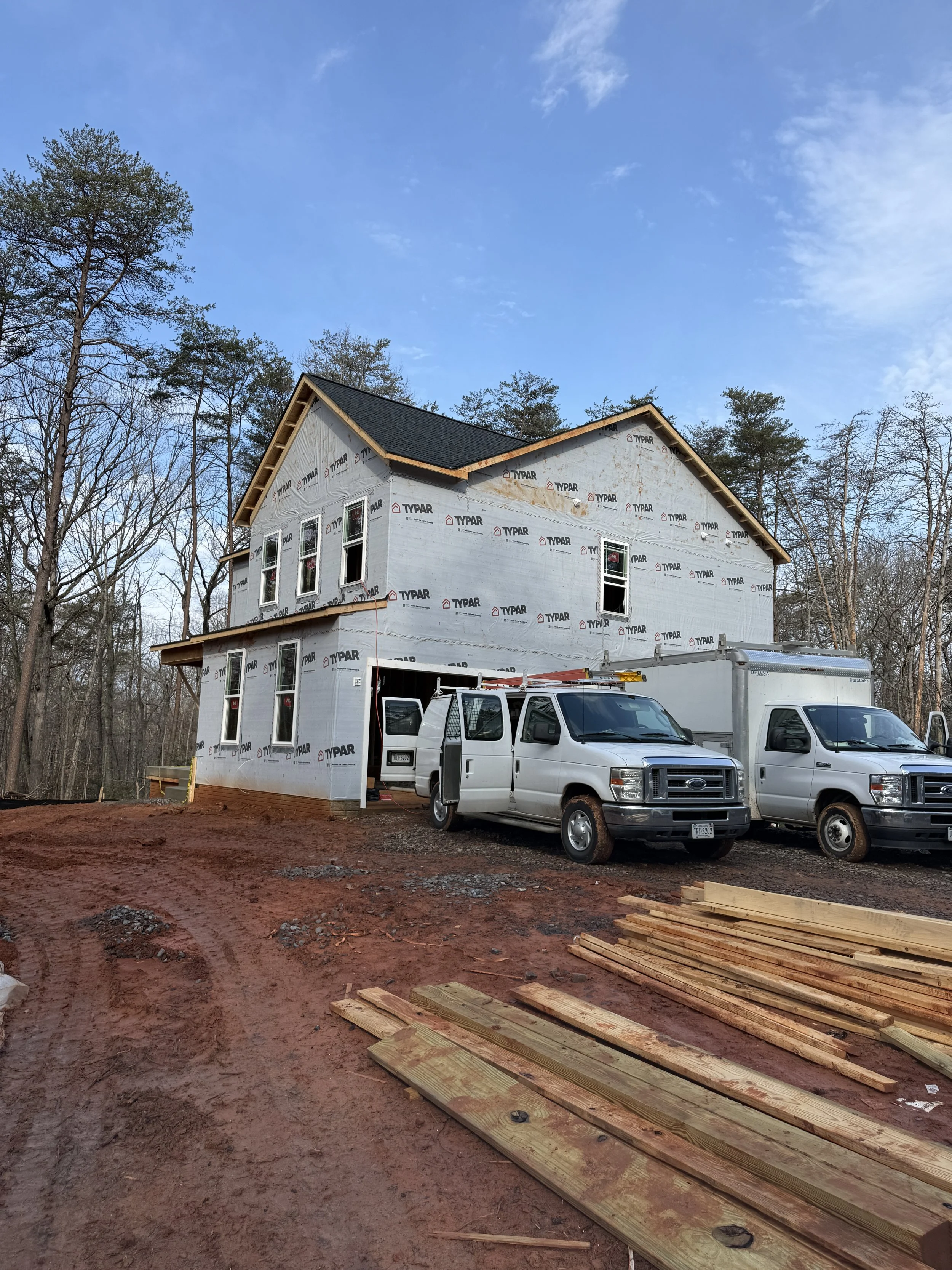 R&W Homes Mason model custom home under roof framing at 10625 Plank Road, Spotsylvania, VA