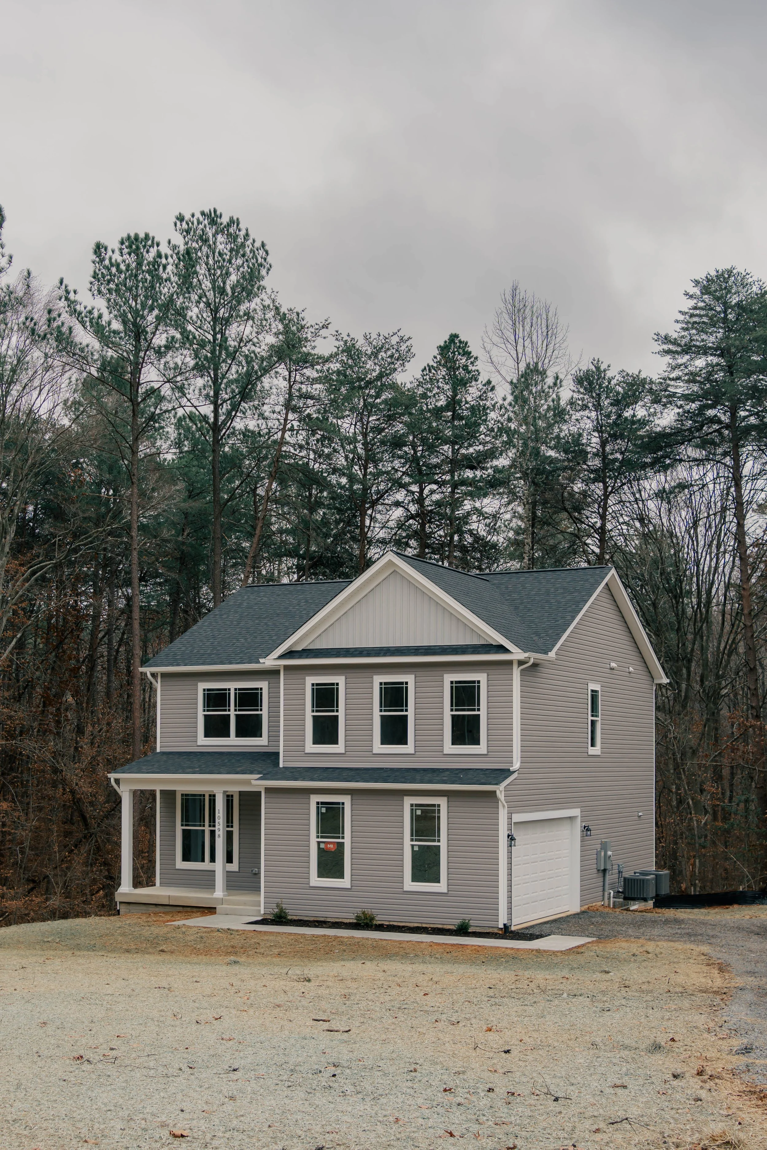 Custom craftsman-style home built by R&W Homes in Spotsylvania County, VA, featuring architectural shingles and a wooded private lot.