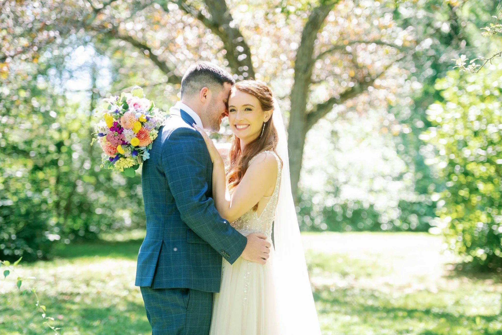 Whimsical wedding at Interlaken Inn in Lakeville, CT featuring wild flowers, soft pastels and custom wedding stationery including water color painted map design and custom monogram.