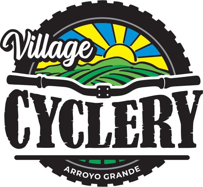 Logo for Village Cyclery featuring a sunrise over green fields with the text 'Village' and 'Cyclery' and 'Arroyo Grande'.