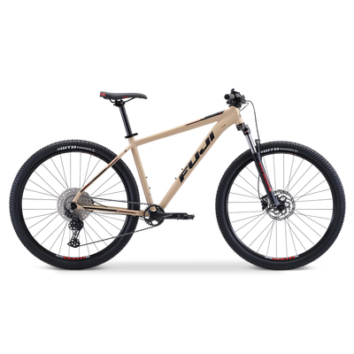 A beige Trek mountain bike with front suspension and disc brakes, viewed from the side.