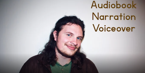 A young man with long dark hair, wearing a green shirt and a dark jacket, standing in front of a light-colored background with text reading 'Audiobook Narration Voiceover'.