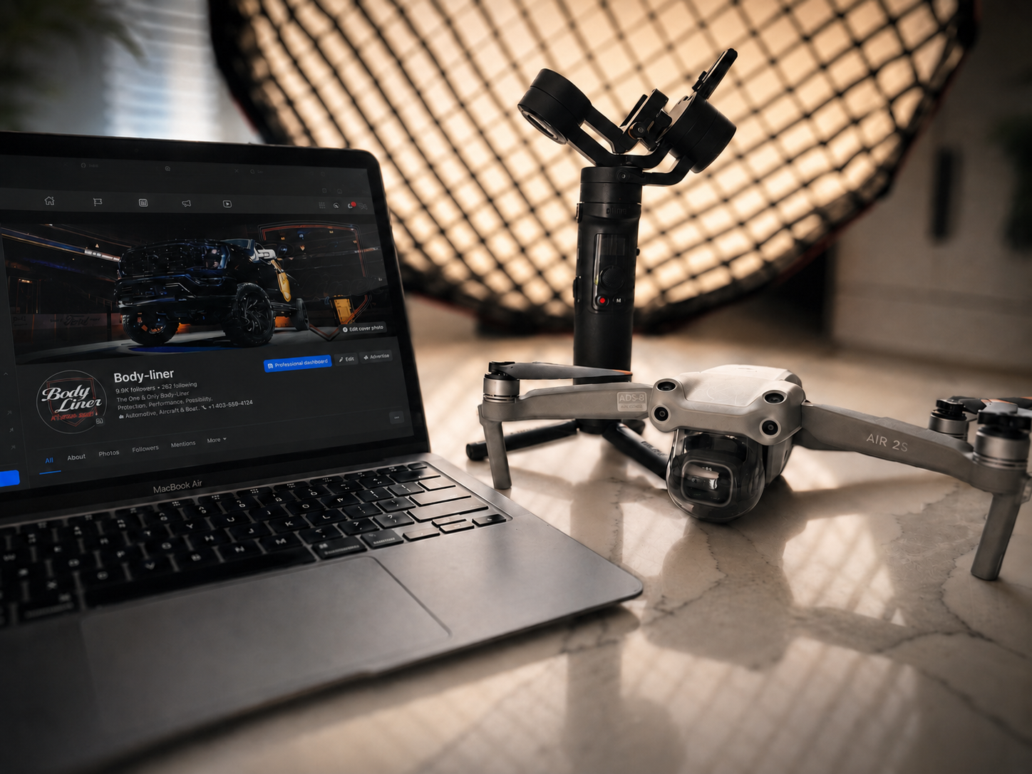 FrameTheory Visuals creative gear, laptop, camera equipment, and drone setup