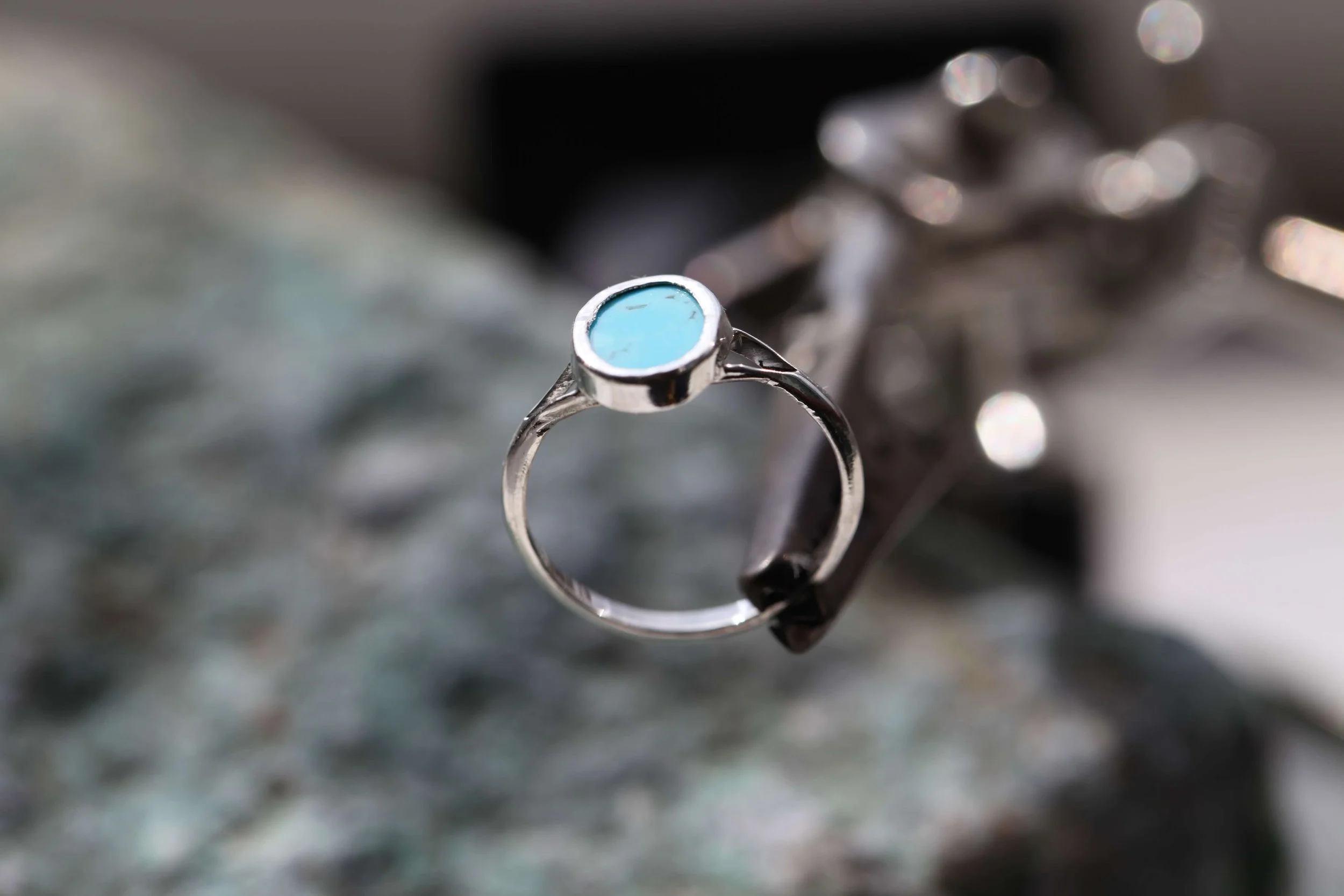 A handmade ring with a turquoise stone