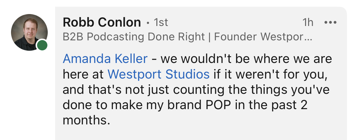 Screenshot of a LinkedIn comment from Robb Conlon, a man with short brown hair, on his profile with a green status indicator. The comment is addressed to Amanda Keller and mentions Westport Studios and branding success over the past two months.