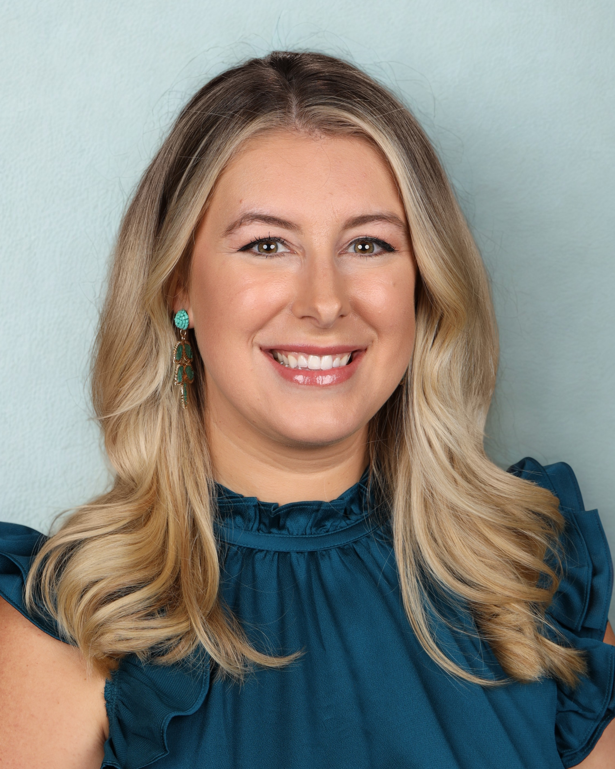 Child's drawing of a turtle with yellow and green background and red and yellow flowers.