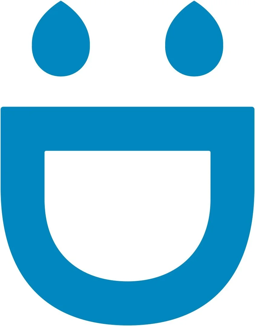 A simplified graphic of a smiling face with two blue teardrop-shaped eyes and a large U-shaped mouth.