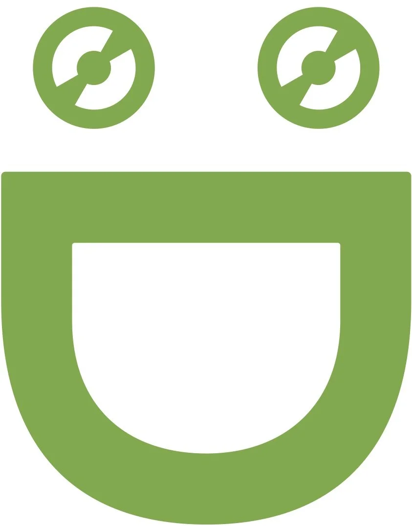 Illustration of a smiling face made of green circles and shapes, resembling a happy cartoon face with two eyes and a mouth.