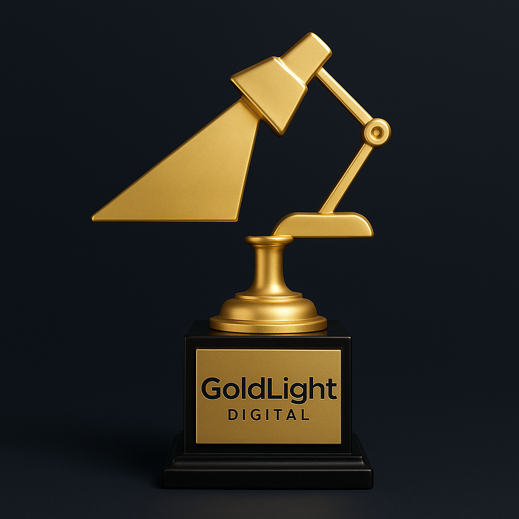 A gold-colored trophy shaped like a desk lamp, on a black base with a gold label reading 'GoldLight DIGITAL'.