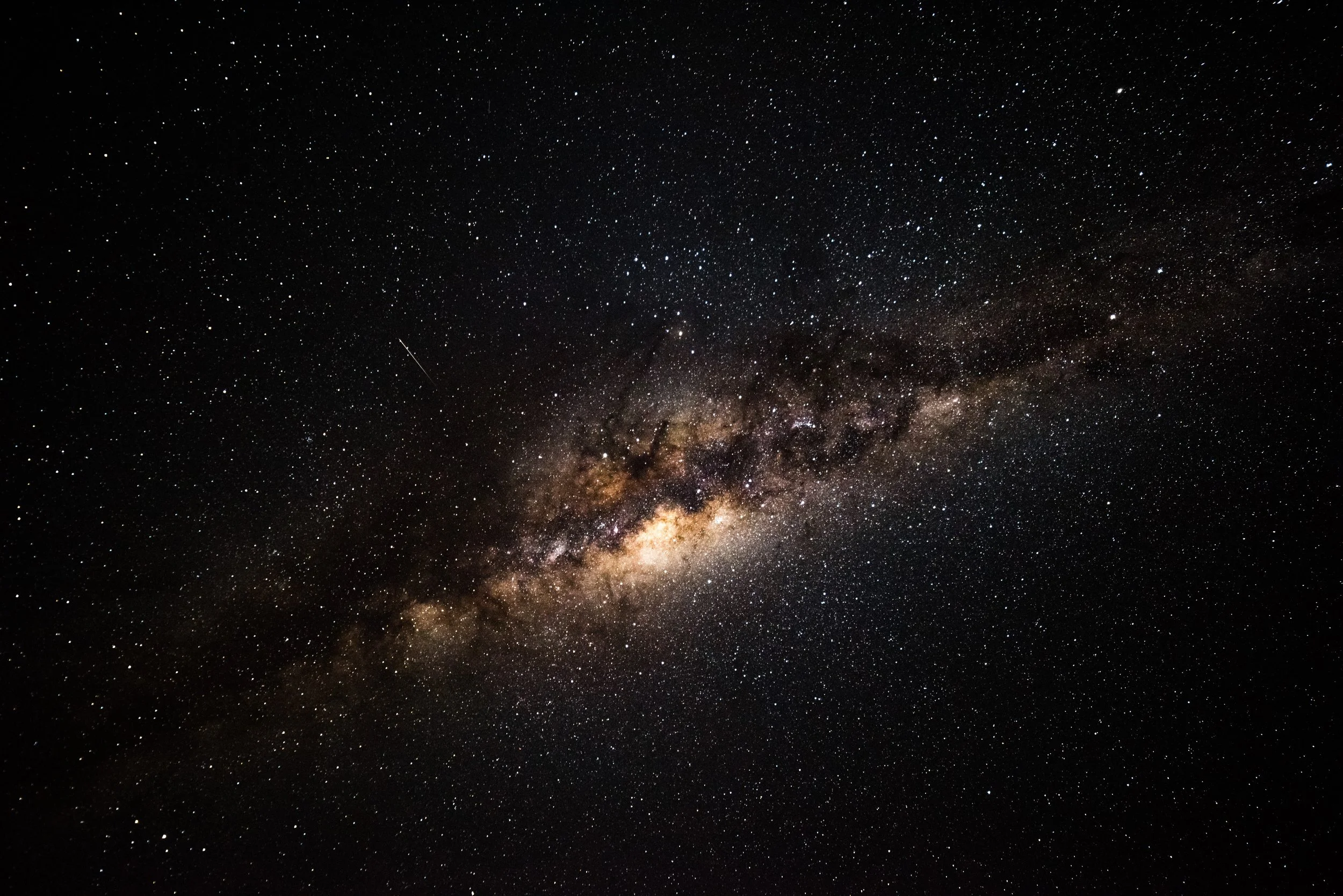 Night sky view of the Milky Way galaxy with countless stars and a bright, dense core.
