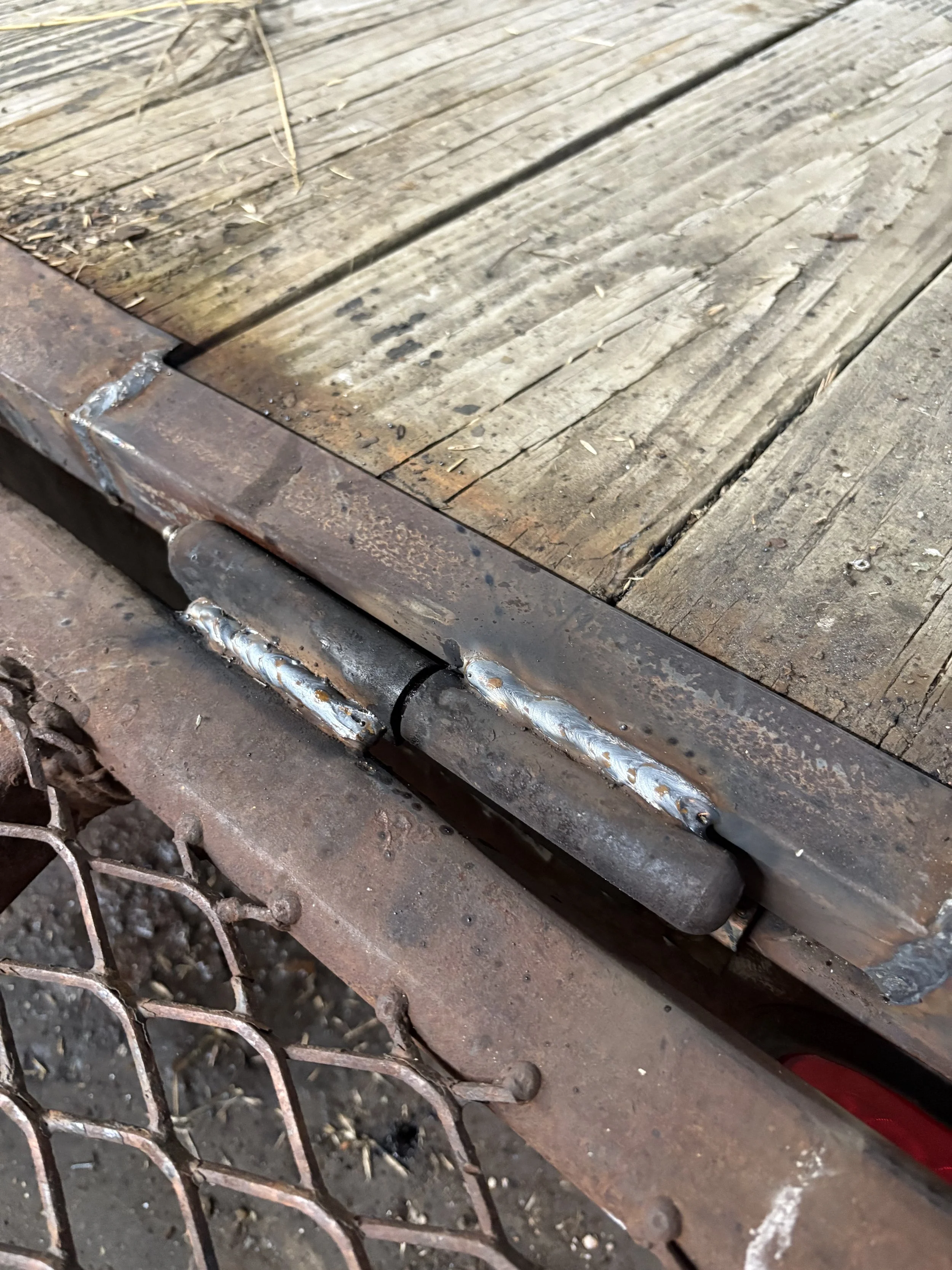 New weld put on this trailer gate hinge so that it closes and lines up properly with the back of the trailer