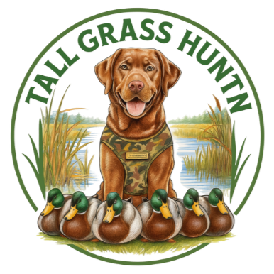 A brown dog wearing camouflage vest sitting in a marshy field with tall grass and water, surrounded by seven ducks. The words "TALL GRASS HUNT" are written in green at the top in a circular design.