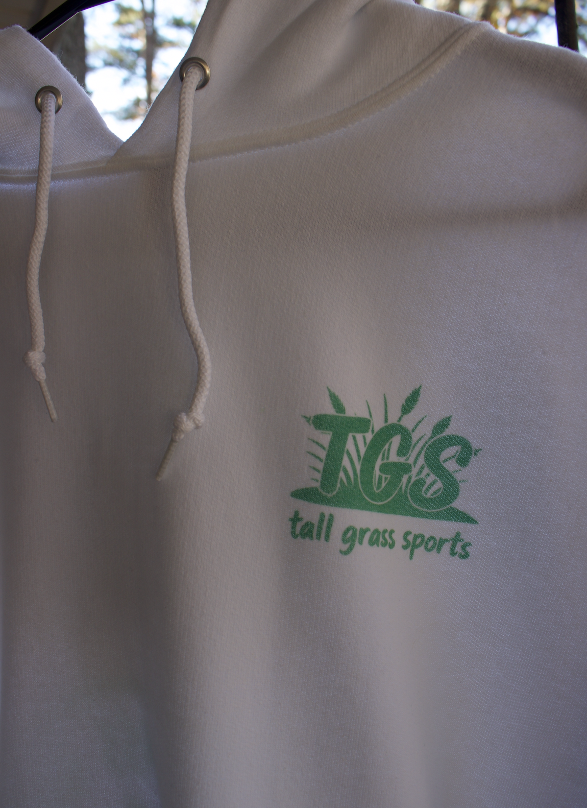 OG golf hoodie front logo closeup.png