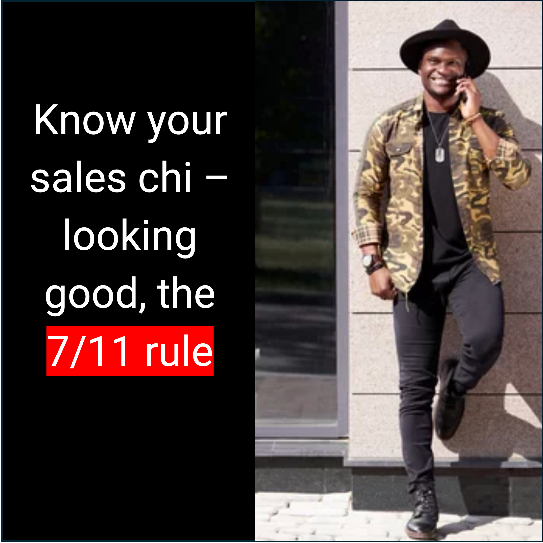 A man wearing a black hat, camouflage jacket, black shirt, black pants, and black boots, smiling and talking on his phone, standing against a beige exterior wall.