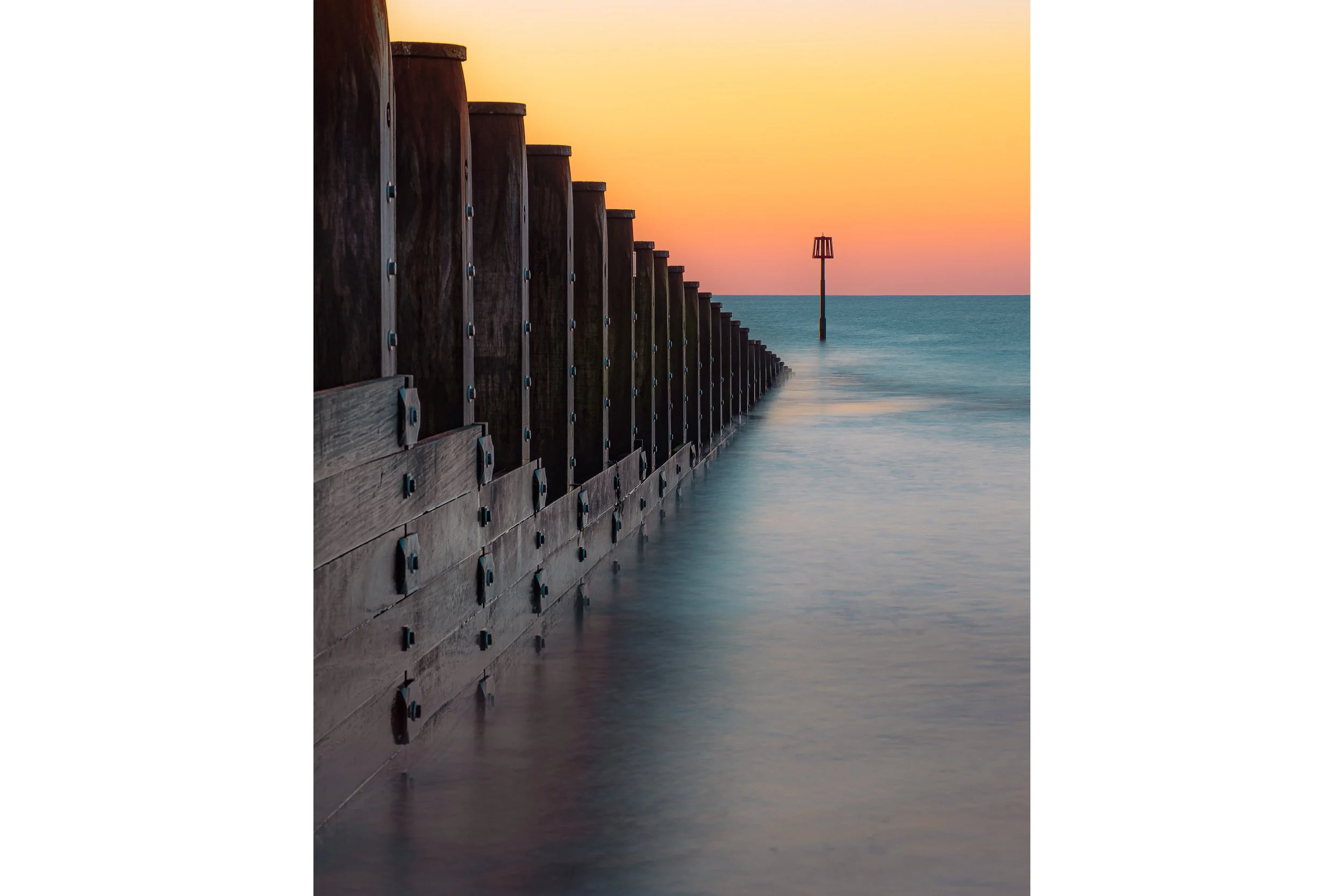 Fine-art print Vanishing Point: dawn light, leading lines, and coastal calm, printed on Fotospeed Platinum Gloss Art Fibre.