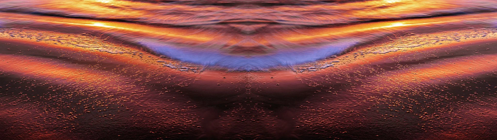 An abstract sunrise formed from wave patterns and reflected light — a fluid, shape-shifting moment from the Sidmouth shoreline.