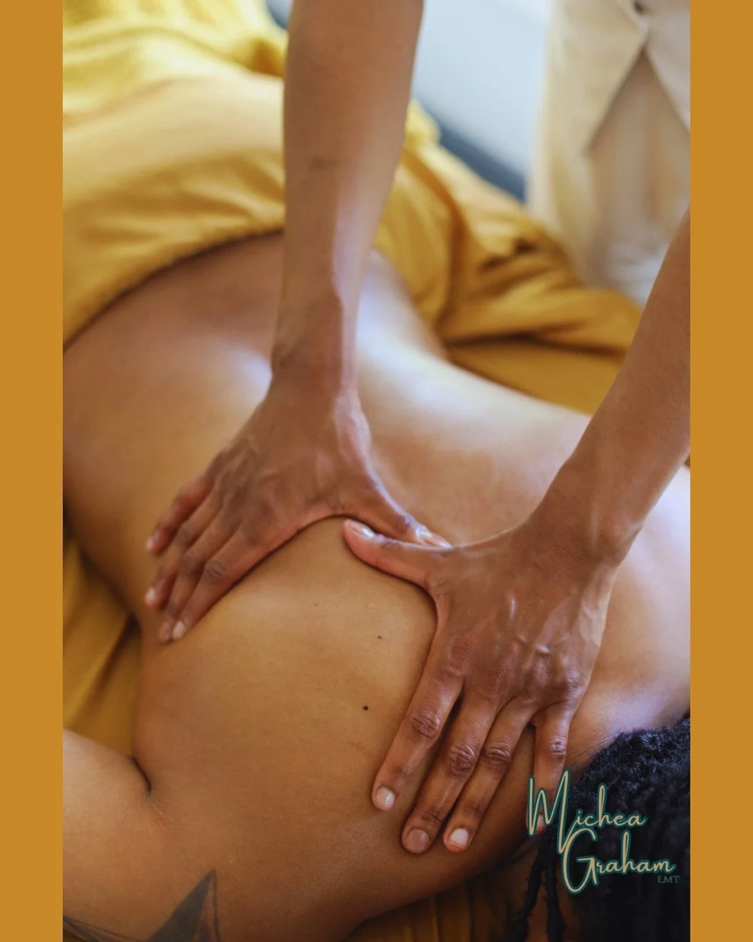 Close-up of a person receiving a massage, lying on their stomach, with a yellow sheet draped over their lower body. The massage therapist's hands are placed on the person's upper back and shoulder area, applying pressure.