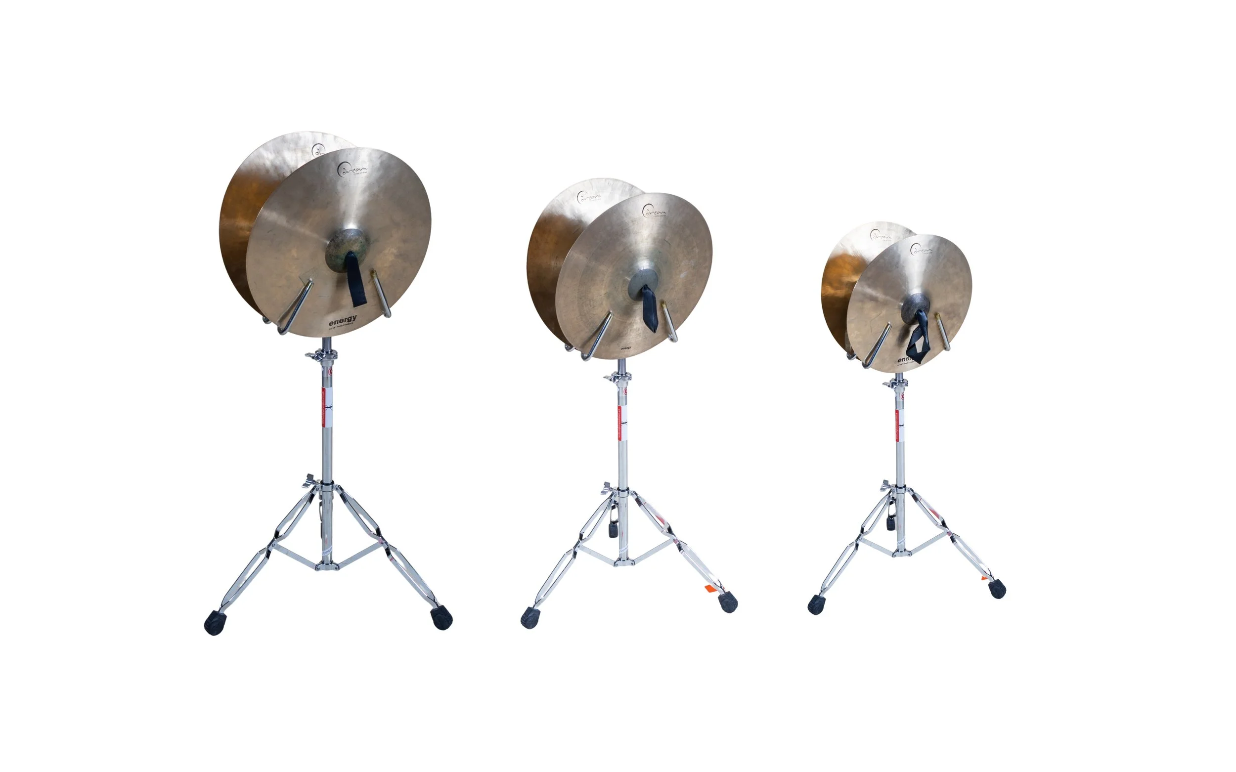 Three cymbals mounted on adjustable tripods against a white background.