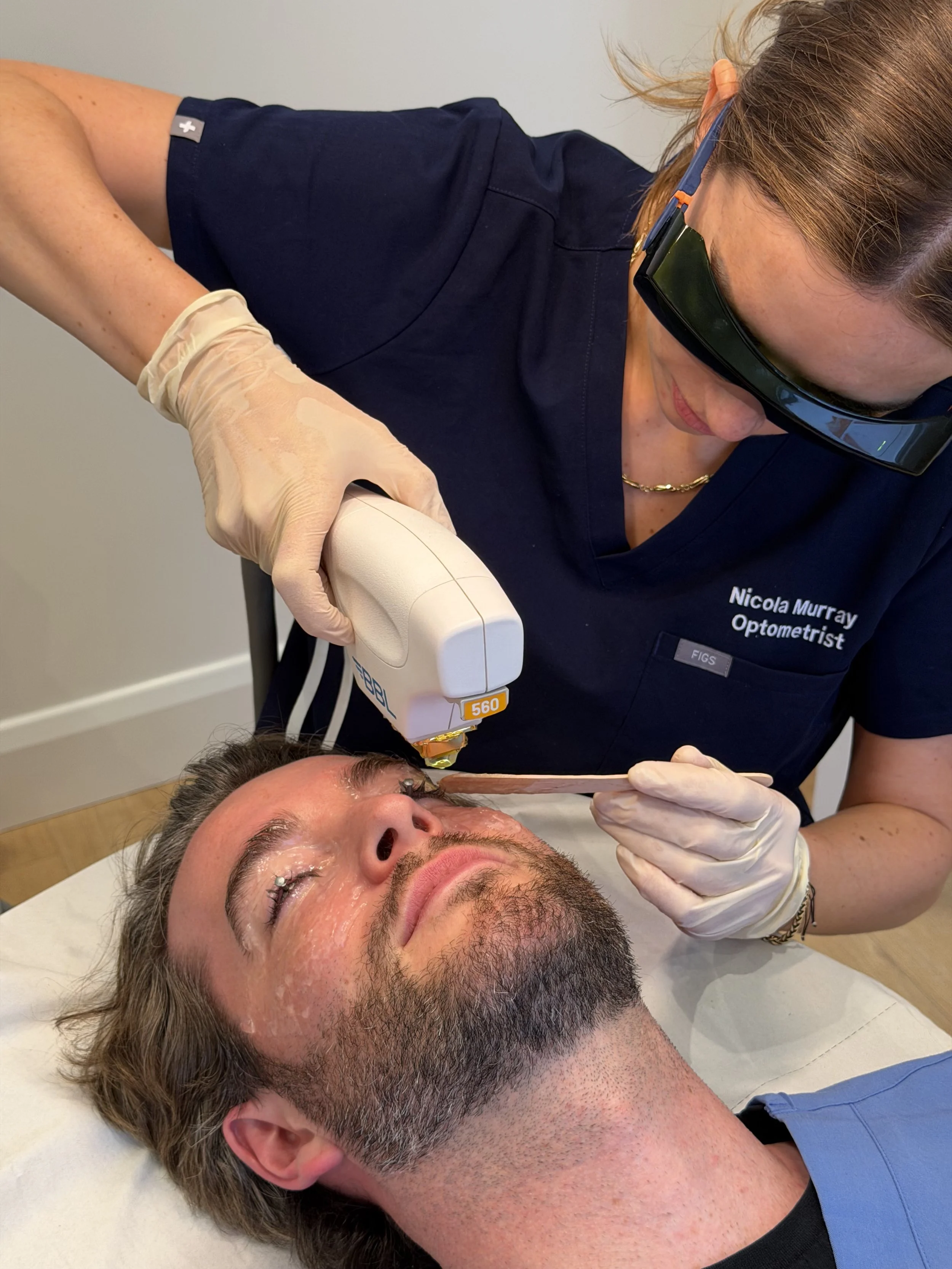 optometrist preforming IPL