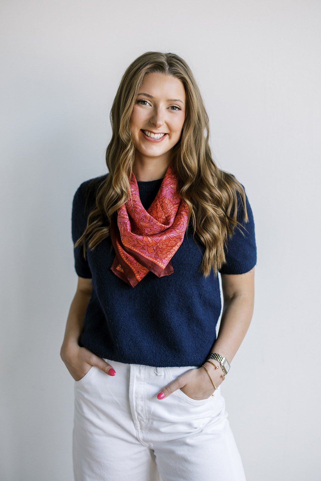 Abby, marketing manager and graphic designer, smiling in head shot