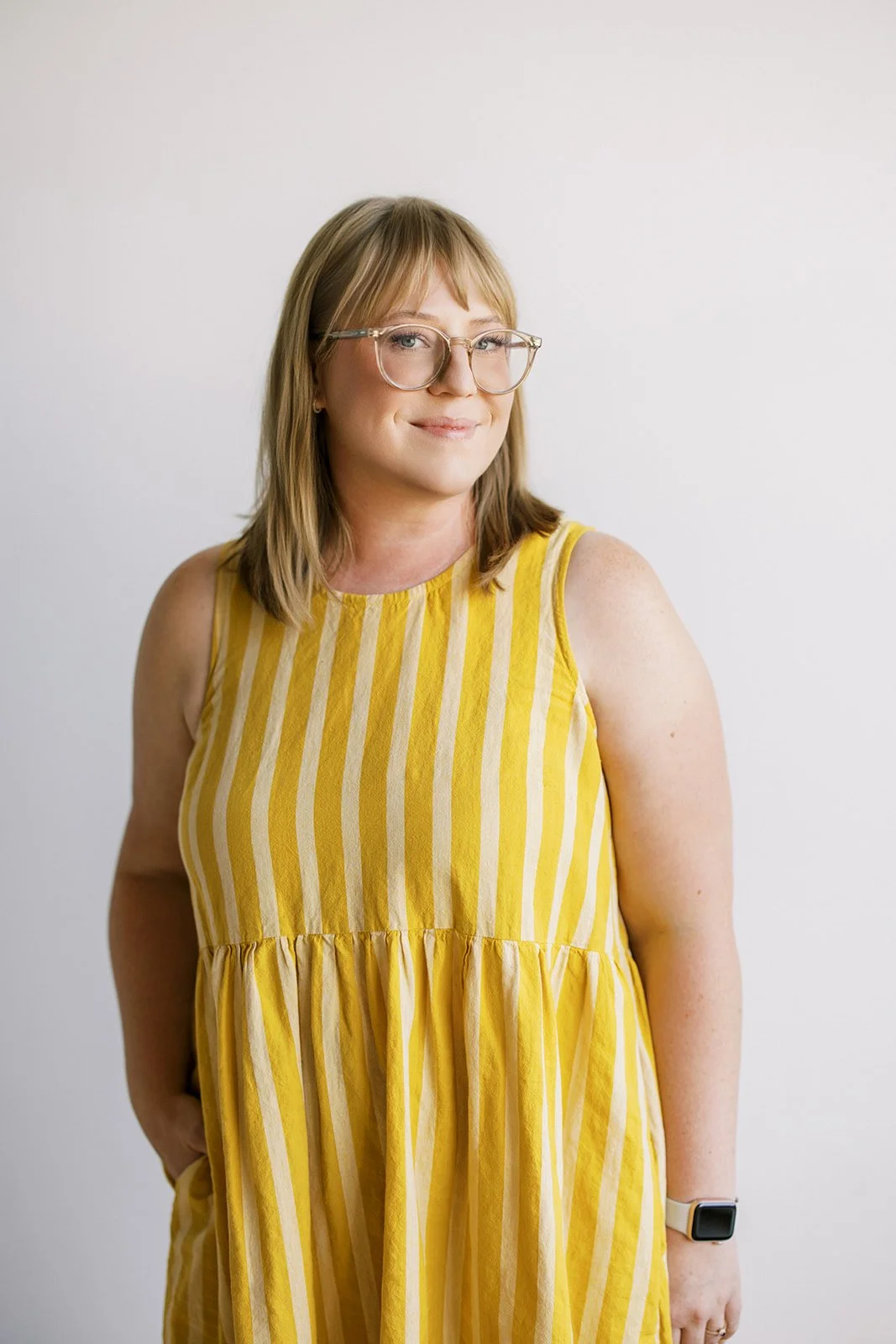 Amber, art director and illustrator at Brand Bash, smiling during photo shoot
