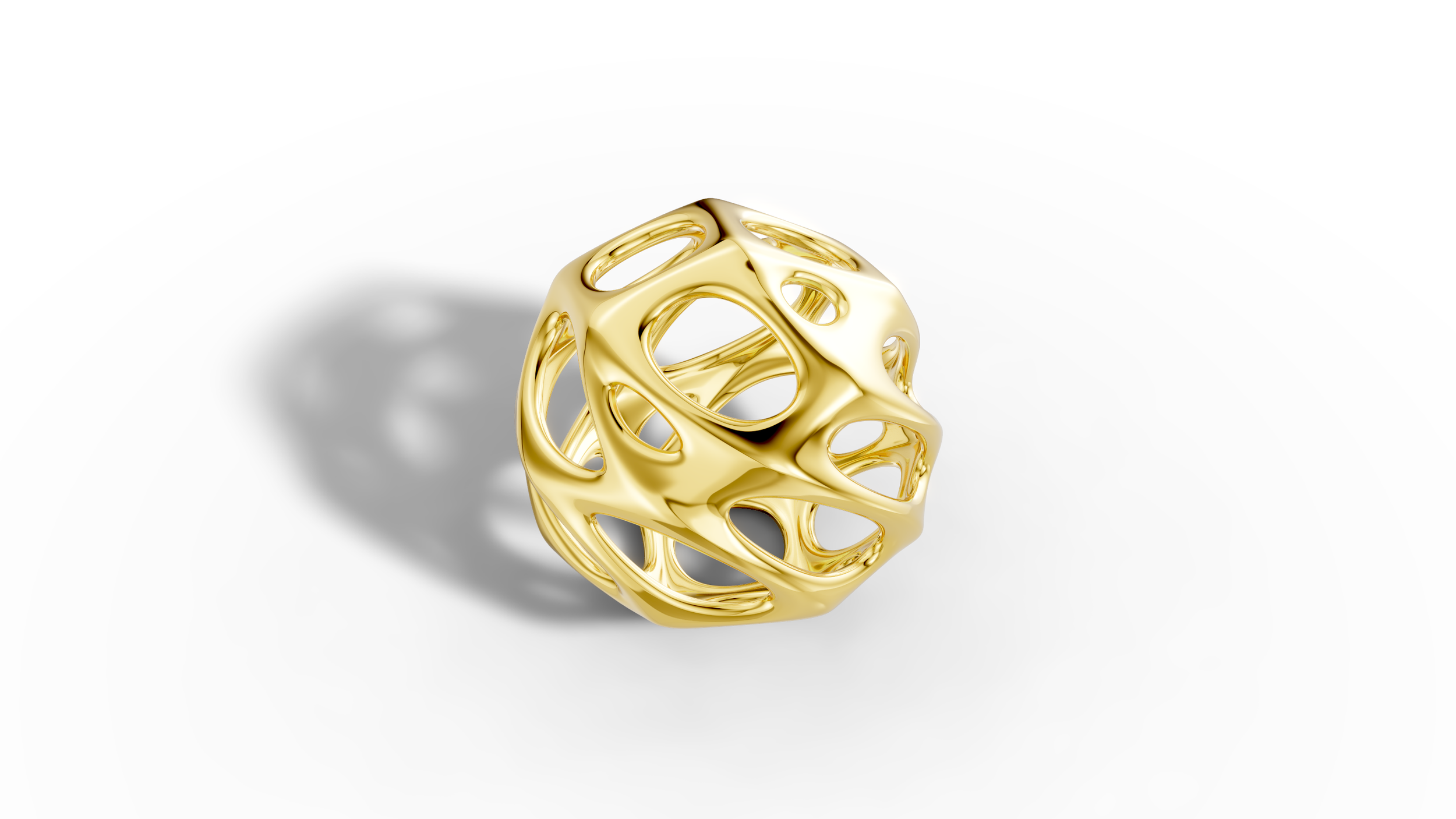 A shiny gold geometric sculpture with interconnected loops, casting a shadow on a white background.
