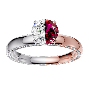 A ring with a two-tone band, featuring a large clear diamond on one side and a red-pink gem on the other, set against a black background.