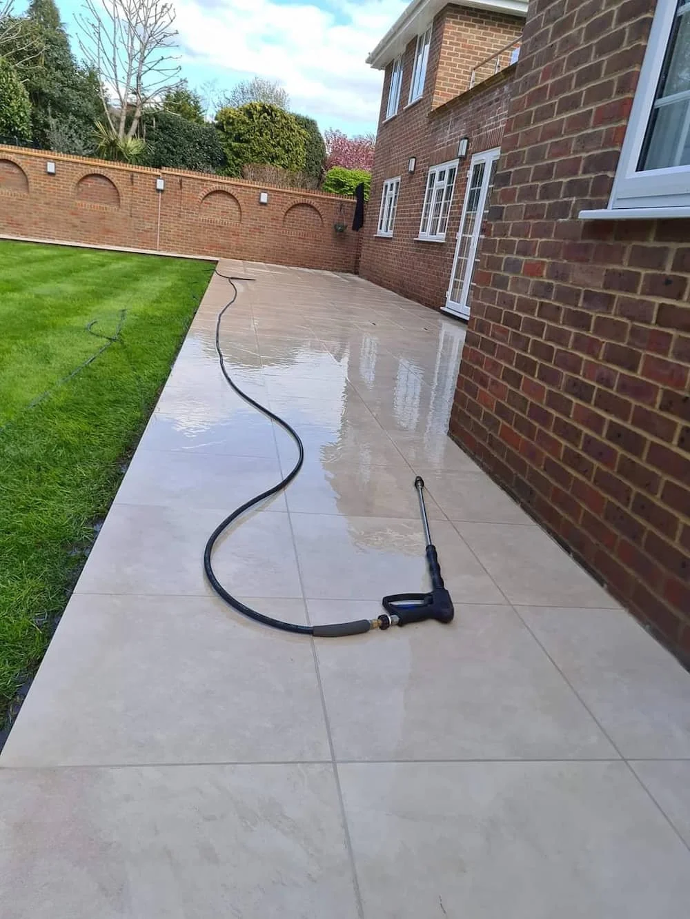 Professional patio jet washing and pressure cleaning service on a residential stone pathway in Tilehurst.