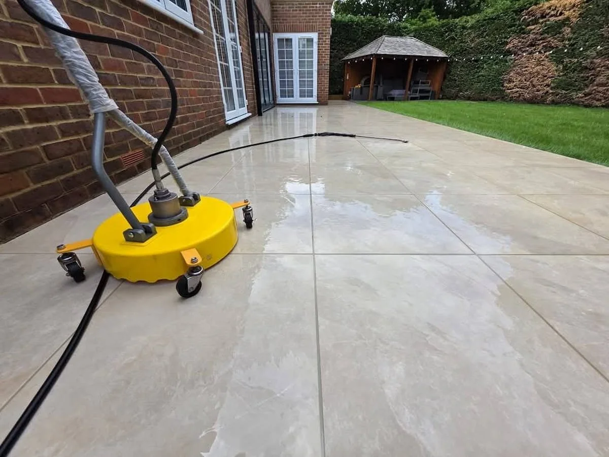 High-end porcelain patio tile cleaning using an industrial flat surface cleaner machine in Waltham St Lawrence.