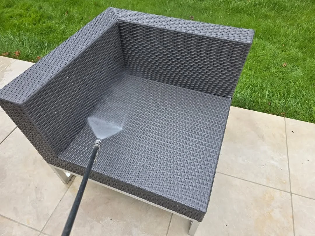 Image of exterior furniture being pressure washed by Immaculate Services back to looking new