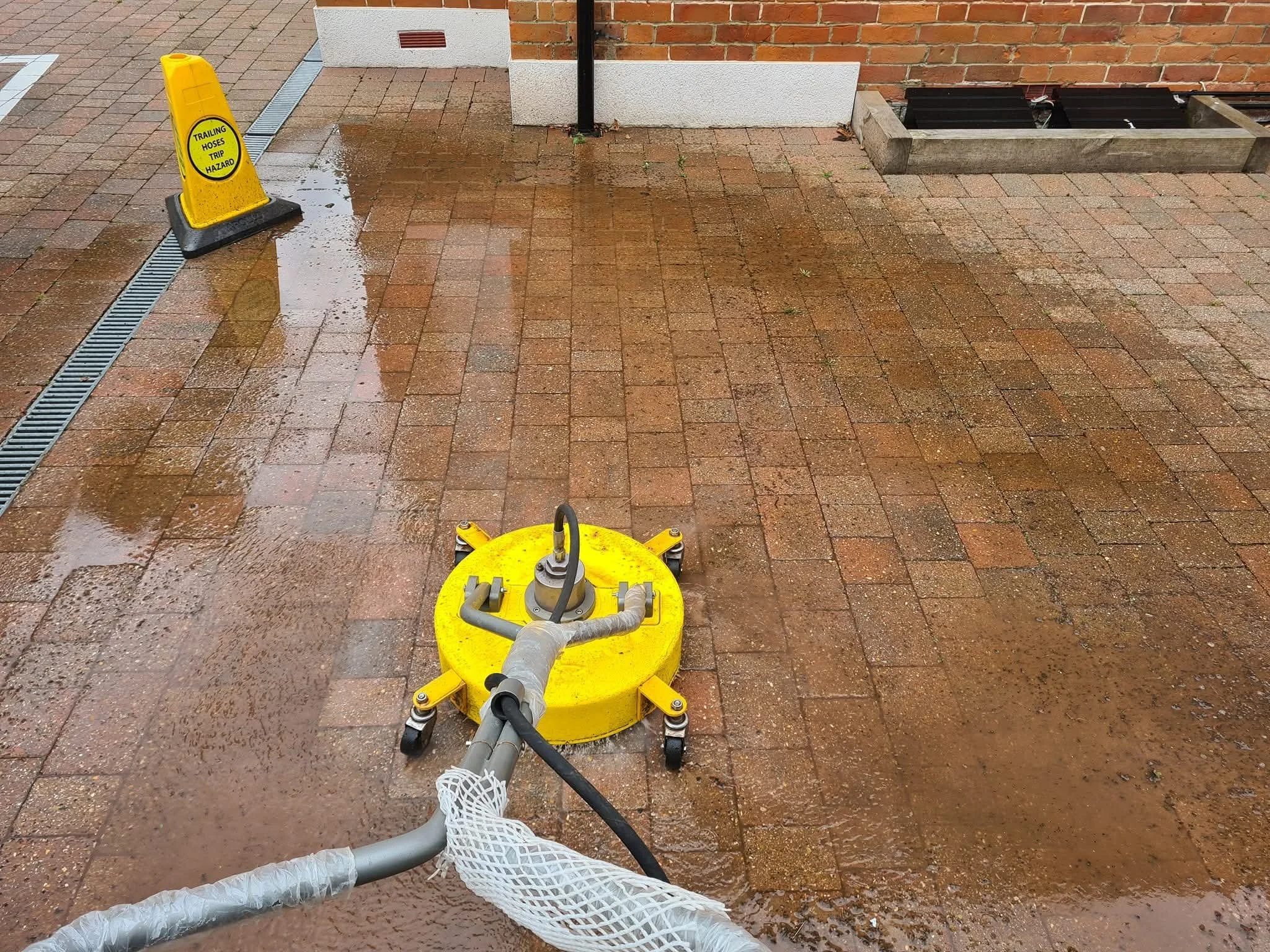 Restored driveway after professional pressure washing in Reading.