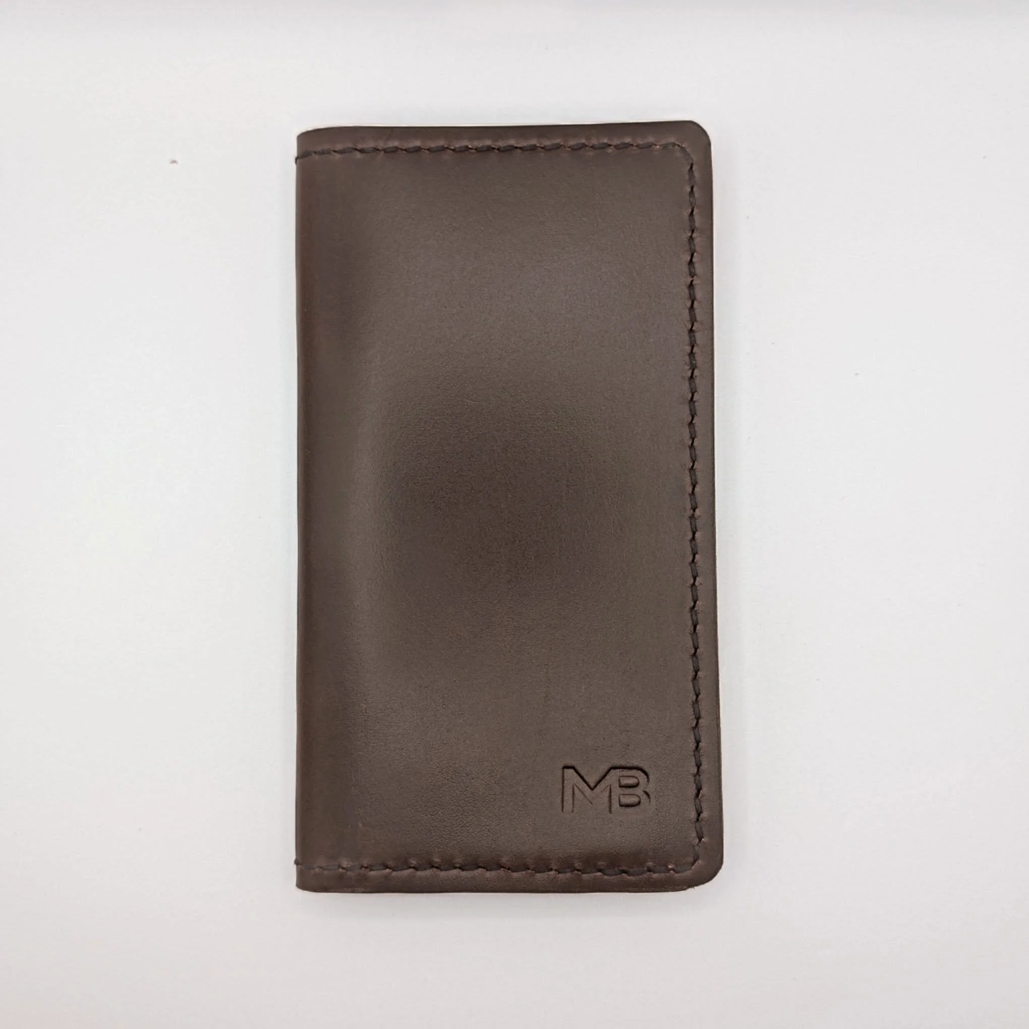Simple double checkbook cover in Horween CXL.
Custom client stamp on the front. 

#leathercraft #horweenleather #edc #handcrafted