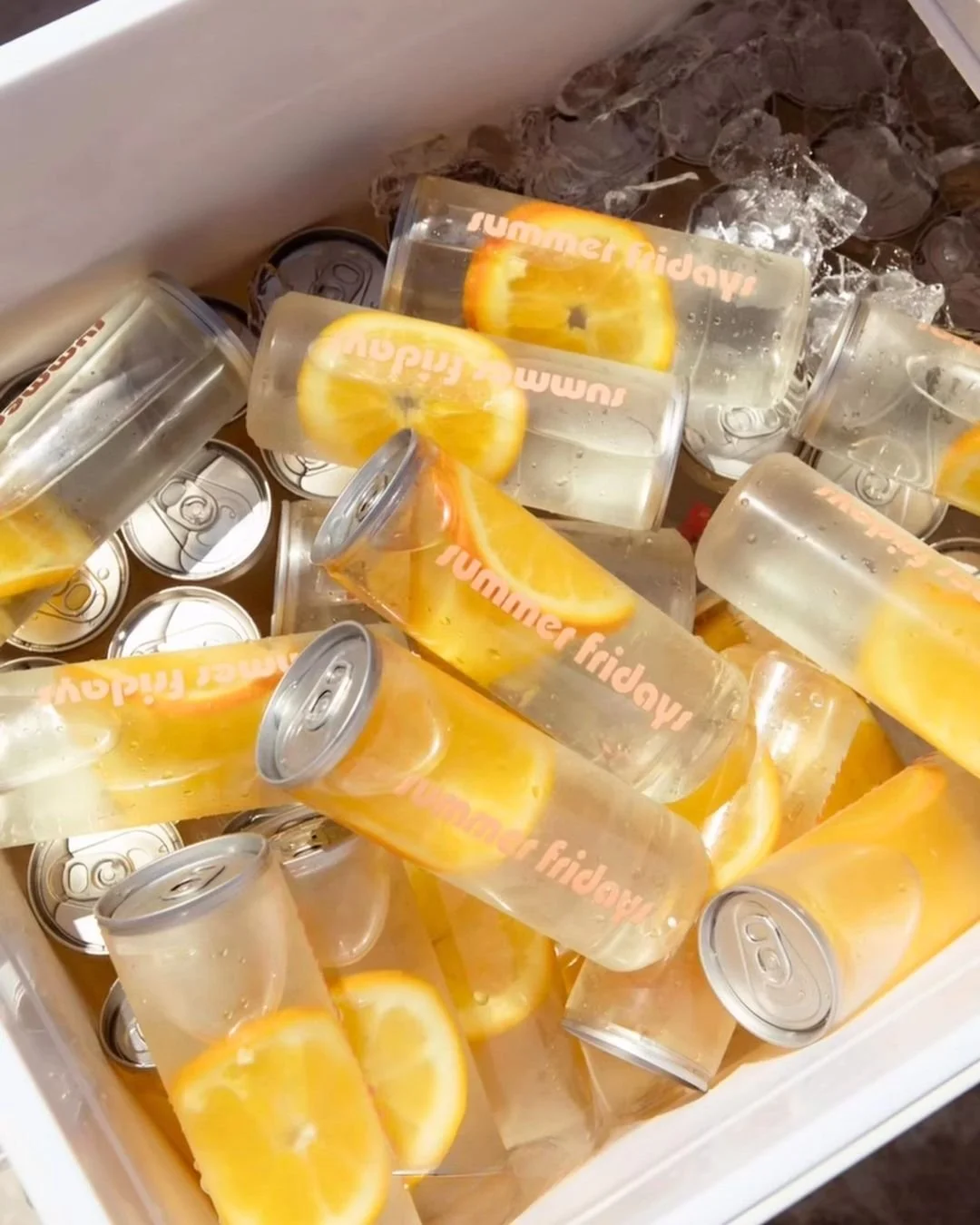 Orange slice branded water bottles custom logo cans pop-up event Miami and New York. Custom Logo water bottles. Custom Drink Events wellness events