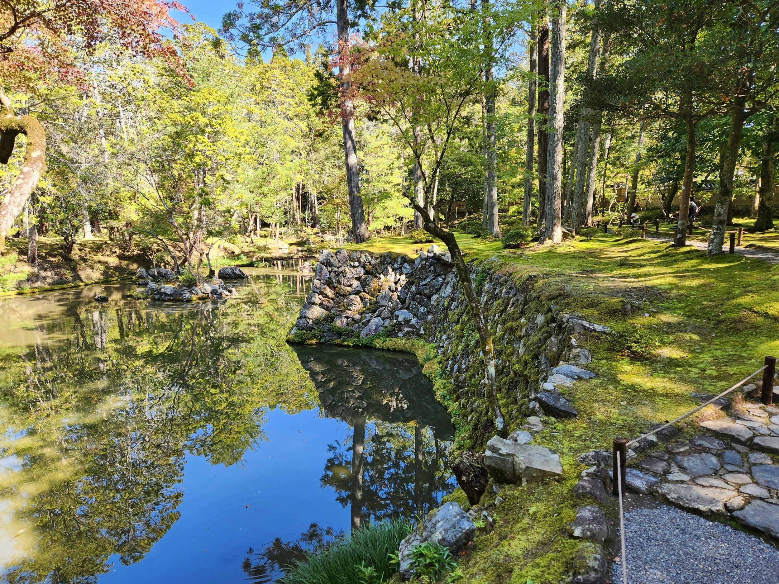 Pond with stone retaining wall at Saijoji