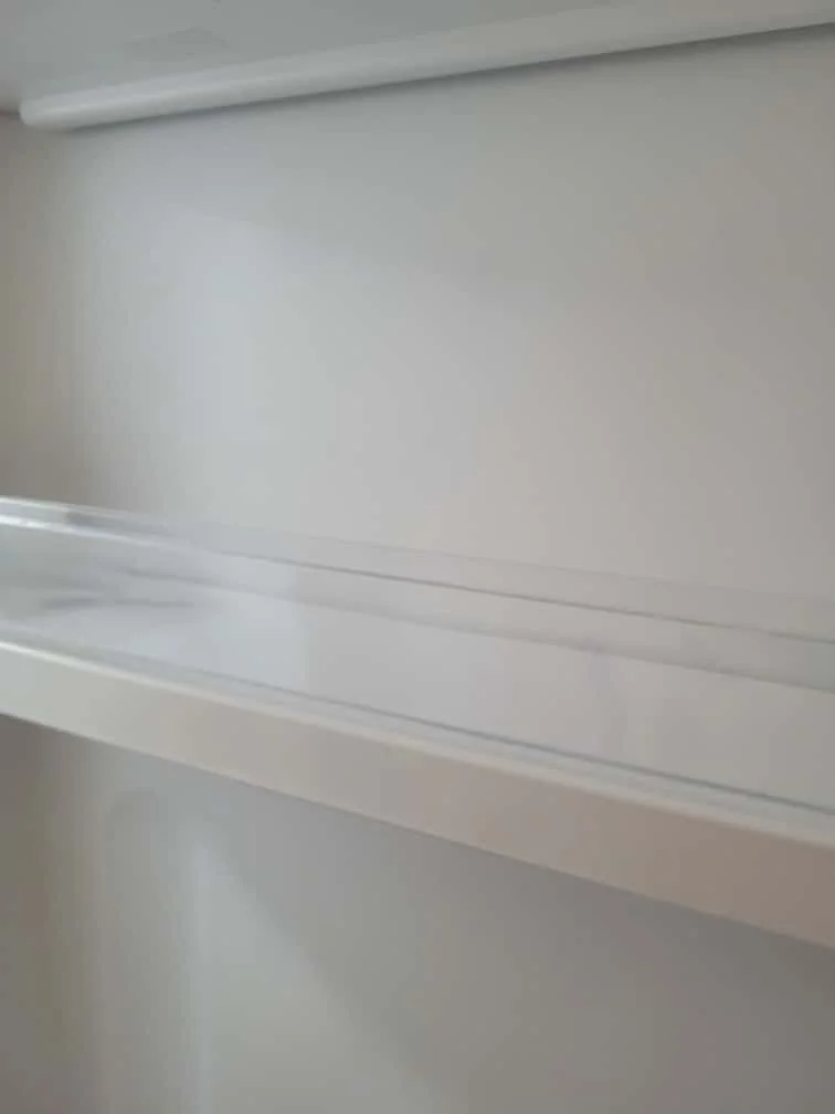 Empty white wall with white molding and trim.