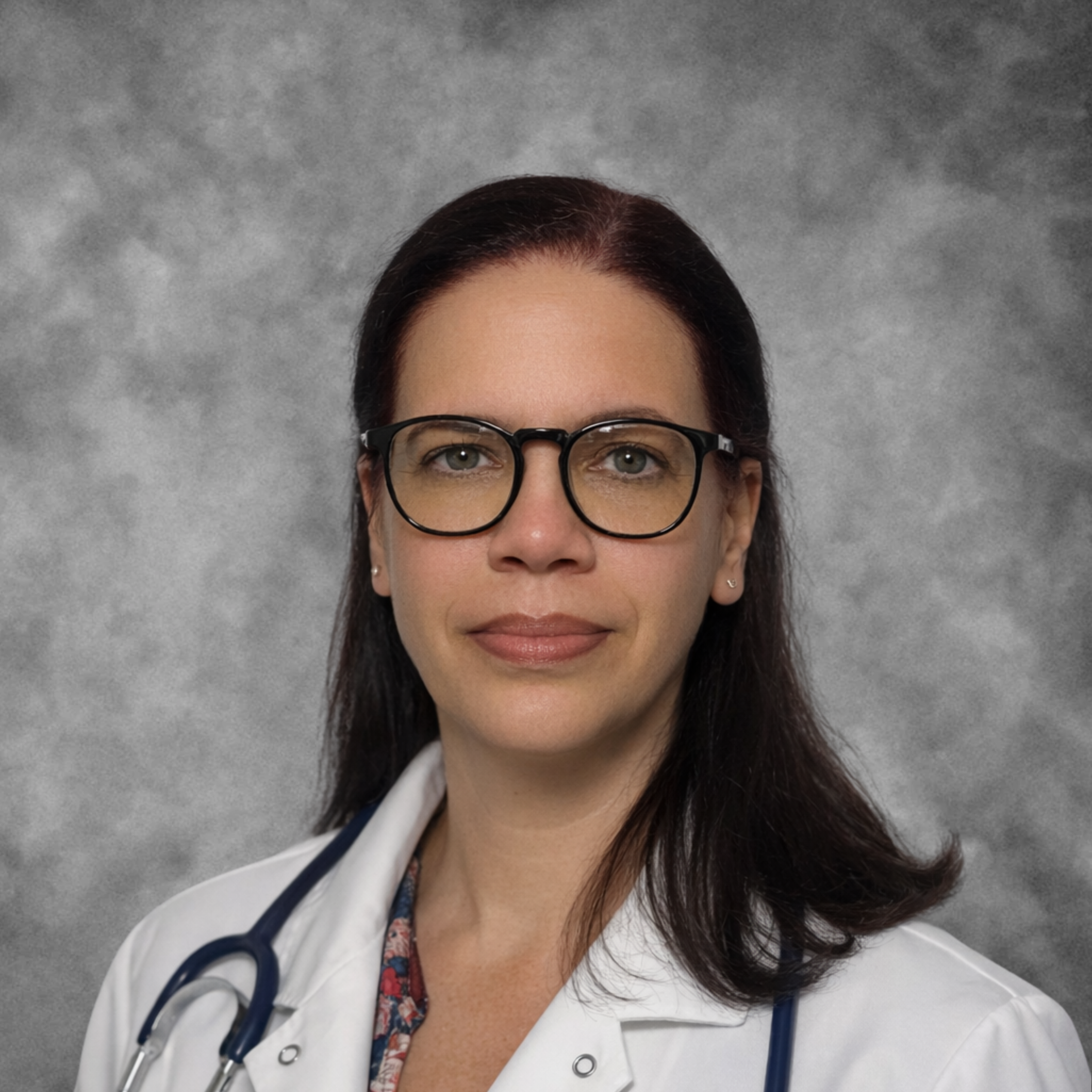 Nighttime landscape showing silhouette of a mountain range across a body of water with a star-filled sky and a bright celestial obj